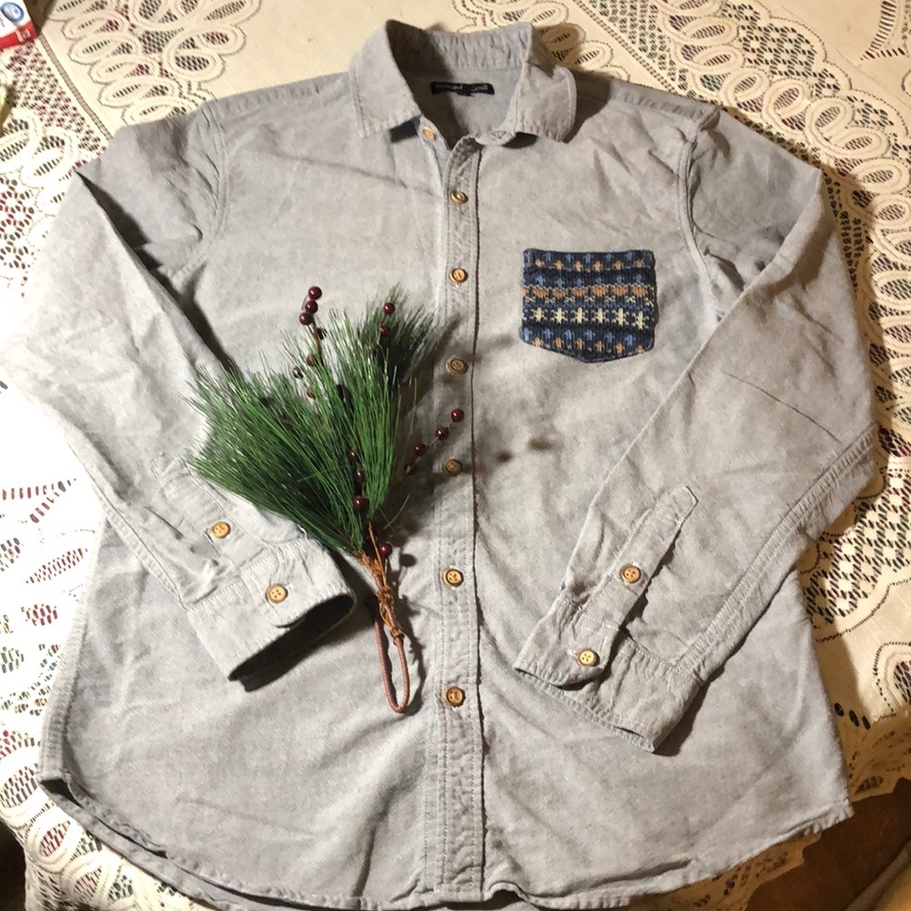 Men’s long sleeved button down shirt.